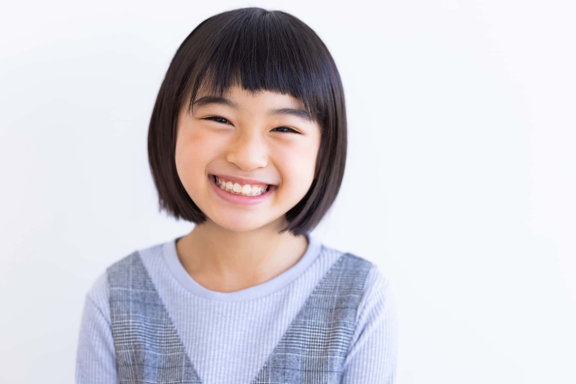矯正をして綺麗な歯並びになった子ども