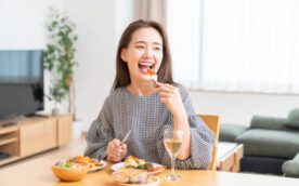 young attractive asian woman who eats